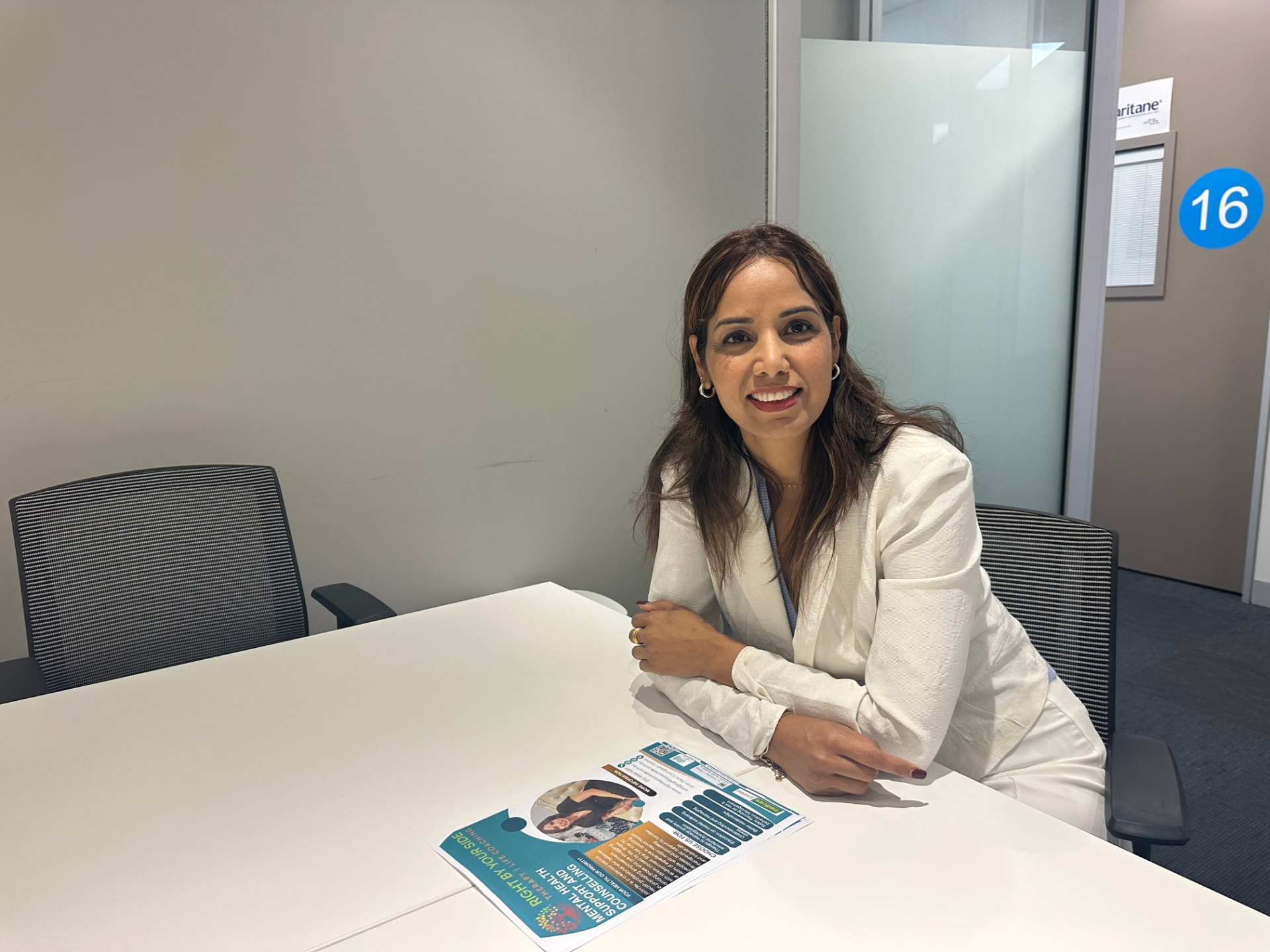 Jatinder Kaur seated at a consulting table